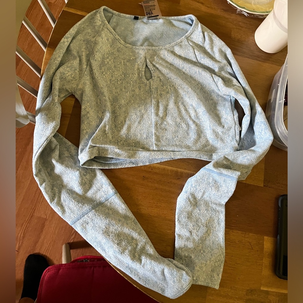 Gymshark crop too long sleeve. Tight fit. Color is a light blue